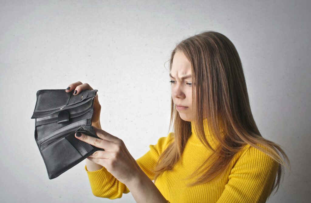 Word of the week Liability
Woman looking at an empty wallet